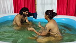 Couple bathing in pool