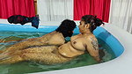 Couple Bathing in Pool