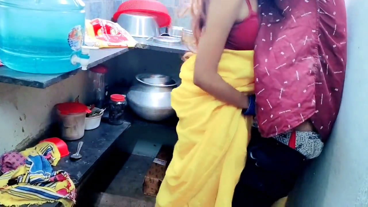 A Couple Is Having Fun in the Kitchen