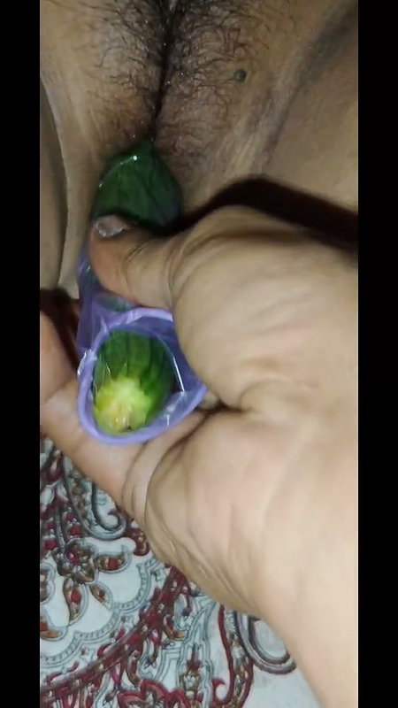 Indian desi sister-in-law with cucumber