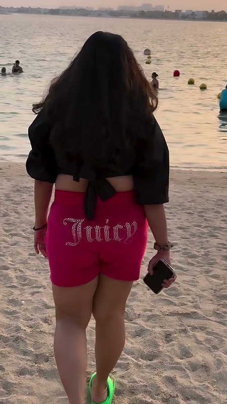 chritian sexy breasts in black beach wear2