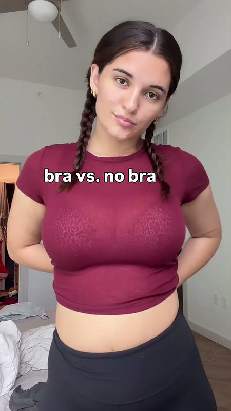 girl removing bra in red shirt 2 2