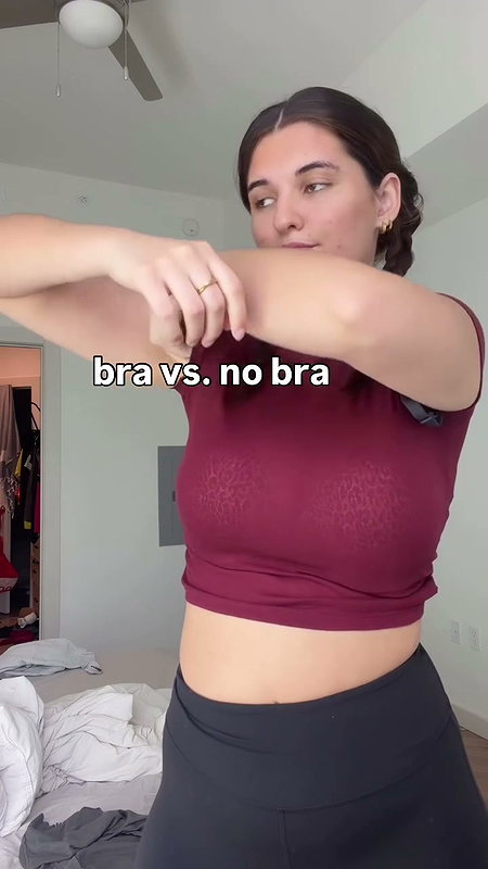 girl removing bra in red shirt 2 2