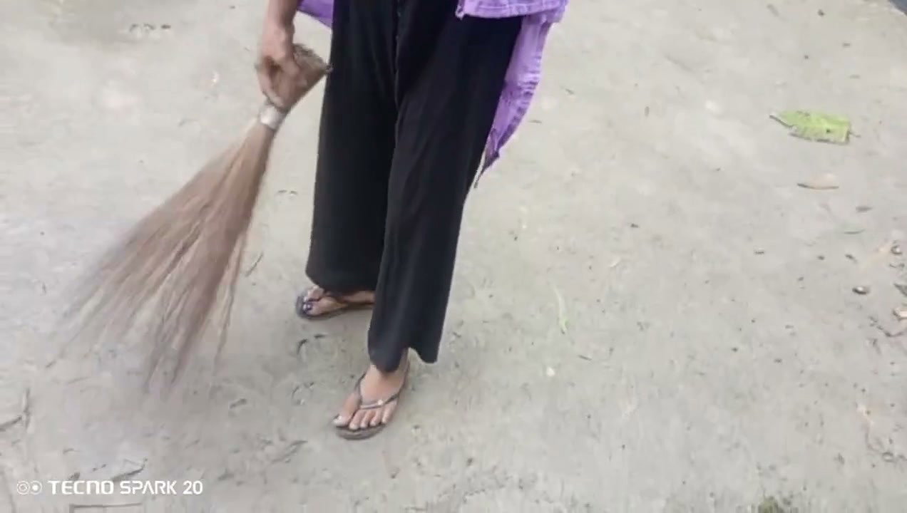 Girl Sweeping the Yard Naked in the Rain – Outdoor Scene