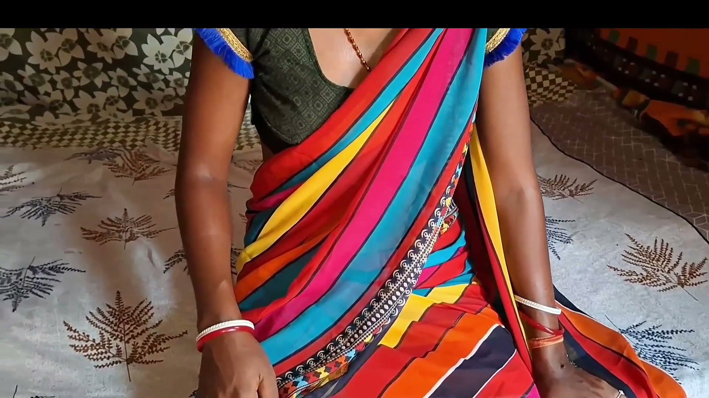 Auntie, clad in a red saree, approaches creating a beautiful and romantic moment filled with love anal sex
