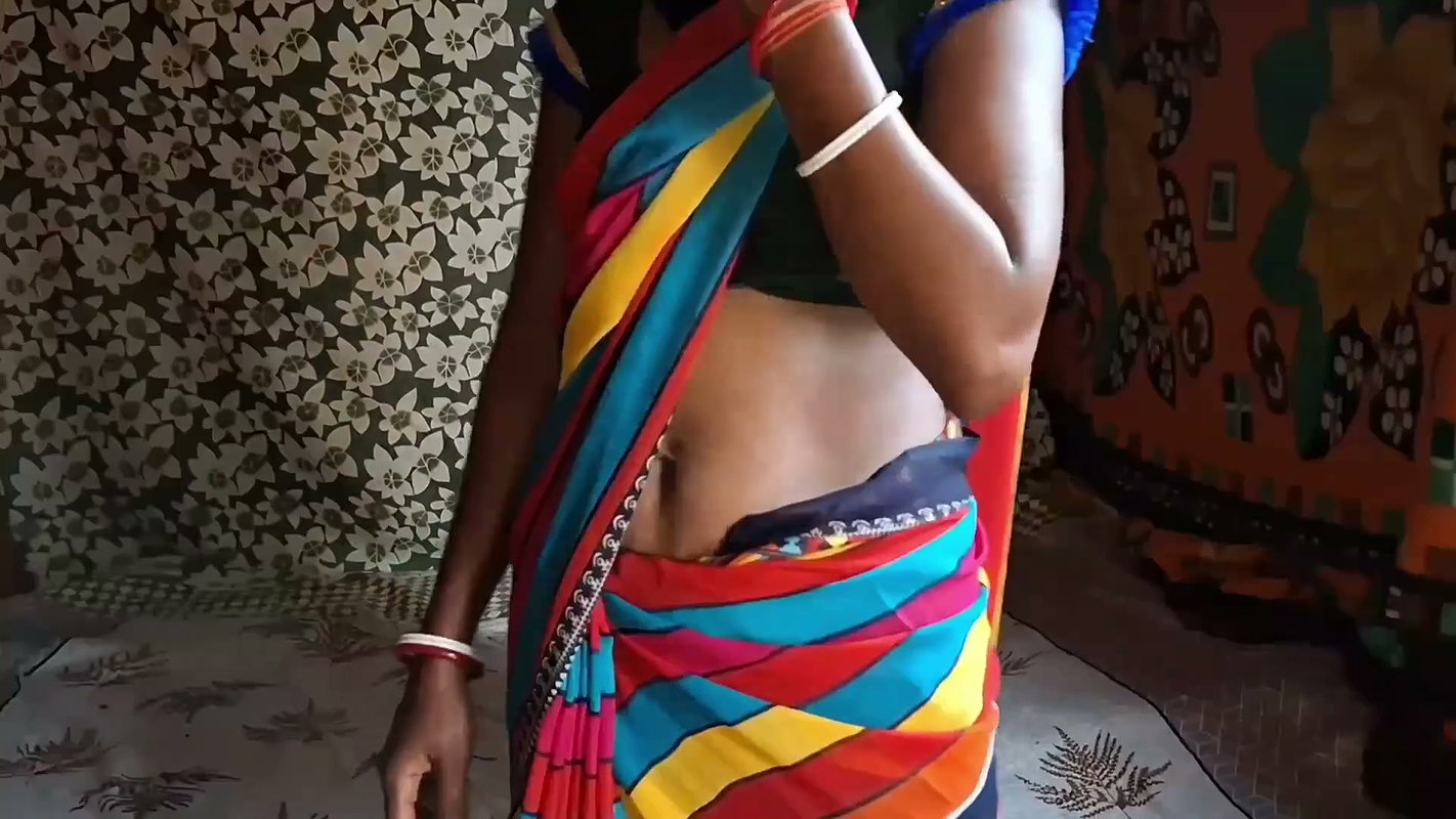Auntie, clad in a red saree, approaches creating a beautiful and romantic moment filled with love anal sex