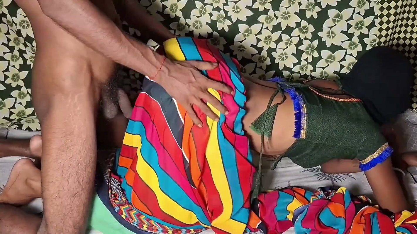Auntie, clad in a red saree, approaches creating a beautiful and romantic moment filled with love anal sex