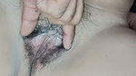 Fingers inserted into pink tight