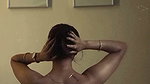 dusk lady removing cloths and showing bare back 2 2