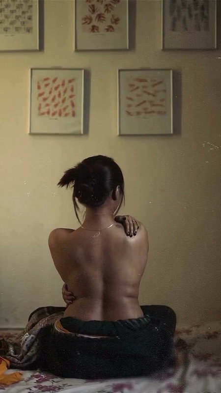 dusk lady removing cloths and showing bare back 2 2