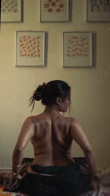 dusk lady removing cloths and showing bare back 2 2