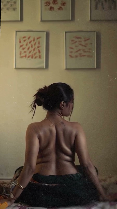 dusk lady removing cloths and showing bare back 2 2