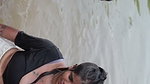 girl in wet blouse and skirt enjoyed in river
