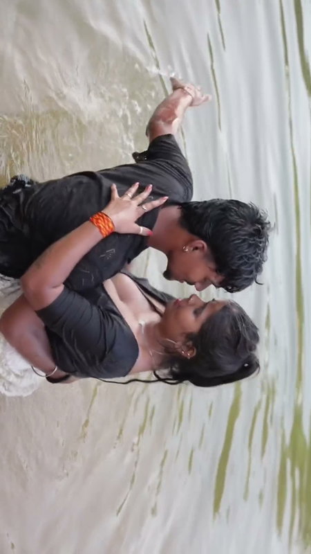 girl in wet blouse and skirt enjoyed in river