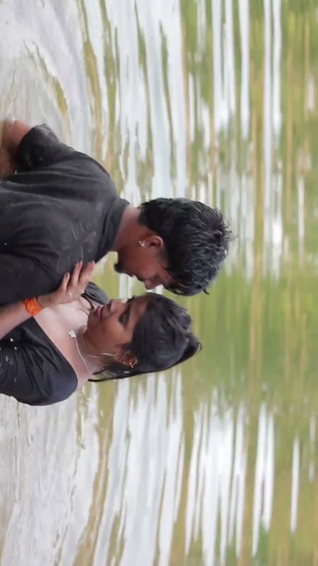 girl in wet blouse and skirt enjoyed in river