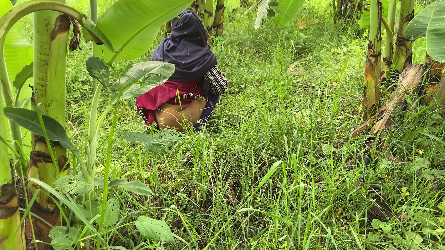 I took my neighbor into the banana plantation and hugged her and started fucking