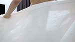 A Thai woman is taking a shower, revealing her pink nipples and smooth, soft vagina while applying body lotion. Real Thai Solo
