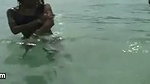Swimming in the ocean with ebony babe