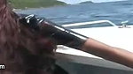 Swimming in the ocean with ebony babe