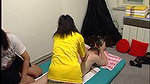 Two thais giving this man a massage