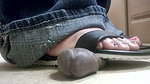 A girl in flip flops tramples a black dick