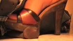 A girl tramples a guy s genitals with her massive heels