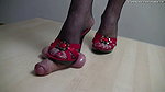 A hottie tramples a guy s cock with both feet at once