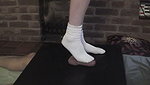 Girl in white socks tramples guy s genitals with her feet