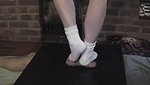 Girl in white socks tramples guy s genitals with her feet