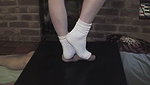 Girl in white socks tramples guy s genitals with her feet