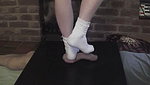 Girl in white socks tramples guy s genitals with her feet