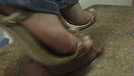 Girl massages guy s penis with shoes