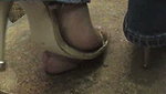 Girl massages guy s penis with shoes
