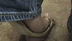 Girl massages guy s penis with shoes