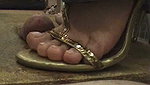 Girl massages guy s penis with shoes