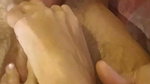Girl presses balls while guy jerks off