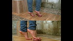 Girl walks barefoot on guy s bare balls