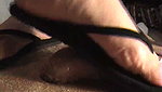 Girl walks on guy s genitals with black flip flops