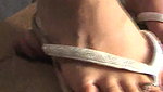 Girl walks on guy s genitals with black flip flops
