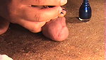 The guy loves trampling his dick with feet