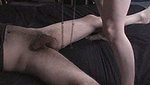 The guy spread his legs so that the girl could punish his genitals