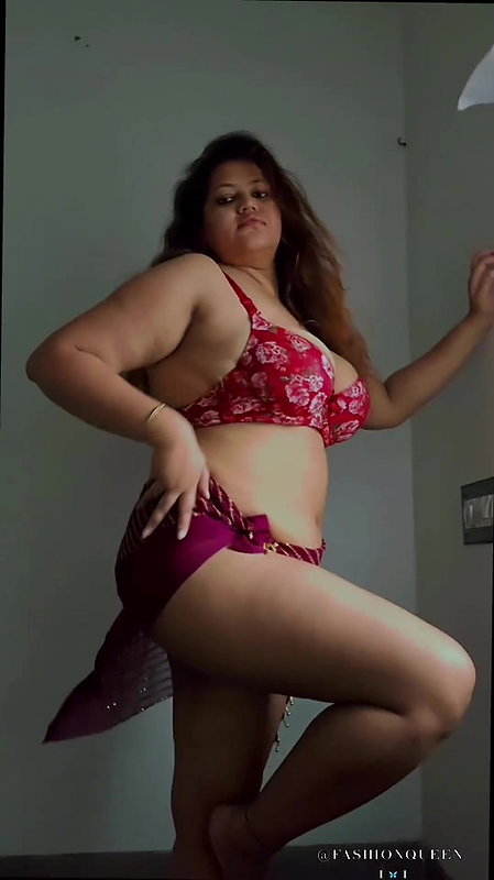 NAUGHTY BUSTY BABE IN BRA AND SARONG SEXY TEASE