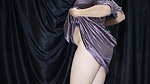 A young girl is trying on a new pair of lingerie