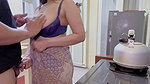 Boarding house woman approaches boarding house residents in the kitchen