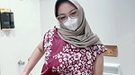 Fountain of a girl in a batik daster dress