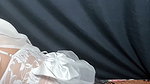 Hijab of the bride rocking on the bed