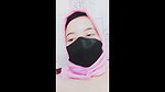 hijab woman playing with dildo in room