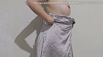 Indonesian girl tries on the latest satin skirt while dancing and showing off her body