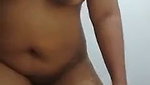 Indonesian maid shows off her plump body while washing clothes in the bathroom