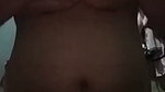 Squeezing the breasts after showering